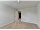 Carpeted bedroom with open doorway and neutral paint at 4349 Northmark Ln, Buford, GA 30518