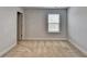 Bedroom with carpeted floor, neutral paint, and window at 4349 Northmark Ln, Buford, GA 30518