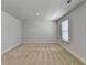 Spacious bedroom with plush carpeting and bright natural light from the window at 4349 Northmark Ln, Buford, GA 30518