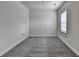 Bright bedroom with neutral walls, soft carpeting, and a window offering natural light at 4349 Northmark Ln, Buford, GA 30518