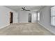 Spacious bedroom features plush carpeting, natural light from a window, and a modern ceiling fan at 4349 Northmark Ln, Buford, GA 30518