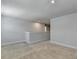 Neutral bonus room with access to other areas of the house; featuring carpet and simple molding at 4349 Northmark Ln, Buford, GA 30518