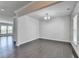 Formal dining room featuring hardwood floors, white walls, a chandelier, and natural light at 4349 Northmark Ln, Buford, GA 30518