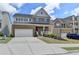 Charming two-story brick home boasts a covered porch, two-car garage, and well-maintained landscaping at 4349 Northmark Ln, Buford, GA 30518