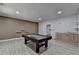 Well-lit game room complete with a pool table, wet bar, and modern flooring for fun gatherings at 4349 Northmark Ln, Buford, GA 30518