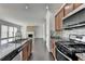Contemporary kitchen with a granite island, stainless steel appliances, and open layout at 4349 Northmark Ln, Buford, GA 30518