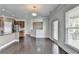 Bright kitchen view with hardwood floors, stainless steel appliances, and large windows at 4349 Northmark Ln, Buford, GA 30518