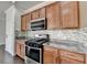 Modern kitchen features stainless steel appliances, granite countertops, and mosaic backsplash at 4349 Northmark Ln, Buford, GA 30518