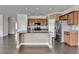 Modern kitchen with granite island, stainless steel appliances, and stylish backsplash at 4349 Northmark Ln, Buford, GA 30518