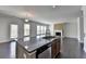 Spacious island in kitchen with stainless steel dishwasher and open view to living room at 4349 Northmark Ln, Buford, GA 30518