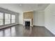 Inviting living room features fireplace, hardwood floors, and plenty of natural light at 4349 Northmark Ln, Buford, GA 30518