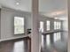 An angled view of the living room, showing the office nook with granite countertop and an exterior glass door at 4349 Northmark Ln, Buford, GA 30518