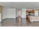 Spacious living area with hardwood floors and seamless flow into the modern kitchen at 4349 Northmark Ln, Buford, GA 30518