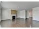 Open-concept living room with hardwood floors and access to other areas of the home at 4349 Northmark Ln, Buford, GA 30518