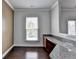 View of the office area with granite countertops and rich hardwood floors at 4349 Northmark Ln, Buford, GA 30518