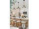 Bright, modern kitchen island with pendant lighting and stainless appliances at 440 Carrera Ln, Acworth, GA 30102