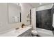 Bathroom features shower and tub combination, updated vanity, and modern lighting at 531 Roy Sw St, Atlanta, GA 30310
