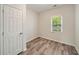 Bedroom features luxury vinyl plank flooring and a window at 531 Roy Sw St, Atlanta, GA 30310