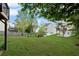 Spacious backyard with green lawn, mature trees, and a wood fence, perfect for outdoor living at 131 Magazine St, Dallas, GA 30157