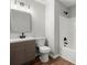 Bathroom featuring vanity, toilet, and shower at 131 Magazine St, Dallas, GA 30157