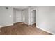 Spacious bedroom with hardwood floors and neutral paint at 131 Magazine St, Dallas, GA 30157