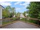 Wood deck with black metal railing overlooking the green backyard at 131 Magazine St, Dallas, GA 30157