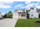 Charming single-story home featuring a yellow front door, attached garage, and well-maintained front yard at 131 Magazine St, Dallas, GA 30157