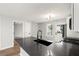 Modern kitchen featuring a black faucet, stylish countertops, and stainless steel appliances at 131 Magazine St, Dallas, GA 30157
