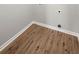 Empty laundry room with washer/dryer hookups and hardwood floors at 131 Magazine St, Dallas, GA 30157