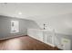 Cozy loft area with white railing and natural light at 131 Magazine St, Dallas, GA 30157