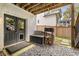 Backyard view with firewood and a gray double door at 2537 Thompson Ne Rd, Brookhaven, GA 30319