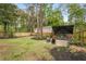 Cozy backyard with comfortable seating under large umbrella at 2537 Thompson Ne Rd, Brookhaven, GA 30319
