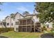 The home's backyard features a two-level deck and screened in porch at 2537 Thompson Ne Rd, Brookhaven, GA 30319