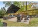 Cozy backyard patio with a fireplace at 2537 Thompson Ne Rd, Brookhaven, GA 30319