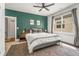 Cozy bedroom with an accent wall, natural light from a window, and modern decor at 2537 Thompson Ne Rd, Brookhaven, GA 30319