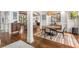 Elegant dining room features hardwood floors, stylish lighting and access to the living area at 2537 Thompson Ne Rd, Brookhaven, GA 30319
