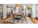 Chic dining room offers a neutral color scheme, modern lighting, and open-concept design at 2537 Thompson Ne Rd, Brookhaven, GA 30319