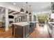 Spacious open kitchen with marble island, stainless steel appliances, and hardwood floors at 2537 Thompson Ne Rd, Brookhaven, GA 30319