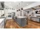 Bright kitchen showcasing a large island, stainless appliances, and an open view to the living area at 2537 Thompson Ne Rd, Brookhaven, GA 30319