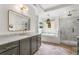 Bright bathroom with marble counters, soaking tub and glass enclosed shower at 2537 Thompson Ne Rd, Brookhaven, GA 30319