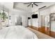 Spacious main bedroom with hardwood floors, tray ceiling, and ensuite bathroom with glass shower at 2537 Thompson Ne Rd, Brookhaven, GA 30319