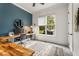 Bright home office with custom wooden desks, a modern aesthetic and a large window for natural light at 2537 Thompson Ne Rd, Brookhaven, GA 30319