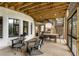 Spacious screened porch features comfortable seating and access to backyard at 2537 Thompson Ne Rd, Brookhaven, GA 30319