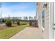 Backyard featuring a patio, lush green grass, and trees at 432 Carrera Ln, Acworth, GA 30102