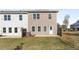 View of the backyard featuring a small patio and green space, perfect for outdoor enjoyment at 432 Carrera Ln, Acworth, GA 30102