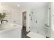Bright bathroom featuring a glass shower, modern fixtures, and stylish tile floors at 432 Carrera Ln, Acworth, GA 30102