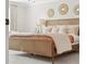 Comfortable bedroom featuring a stylish bed with neutral bedding and decorative wall accents at 432 Carrera Ln, Acworth, GA 30102