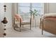 Bedroom featuring a decorative chair, modern side table, and large windows at 432 Carrera Ln, Acworth, GA 30102