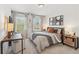 Well-lit bedroom featuring a desk area, neutral tones, and comfortable furnishings at 432 Carrera Ln, Acworth, GA 30102