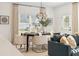 Elegant dining area with modern furniture, ample natural light, and tasteful decor at 432 Carrera Ln, Acworth, GA 30102